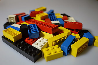 Colorful pile of building blocks on white background