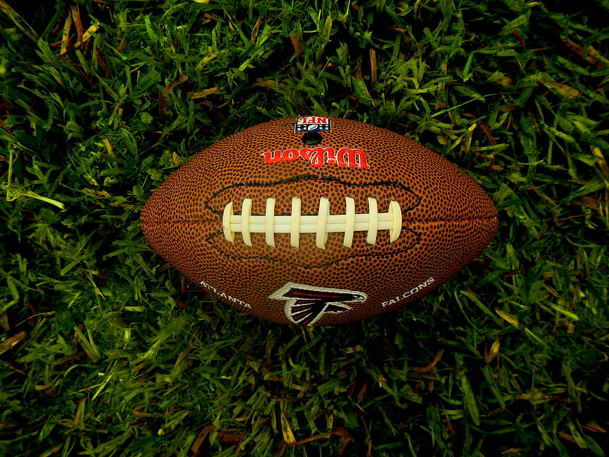 Atlanta Falcons NFL football on green grass