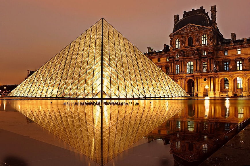Illuminated Louvre Pyramid Reflection at Night