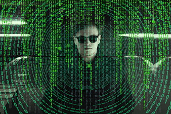 Man in sunglasses with green digital code overlay