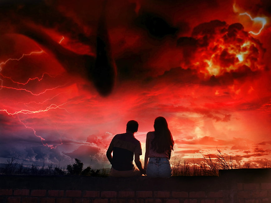 Couple Silhouette Watching Dramatic Red Stormy Sky