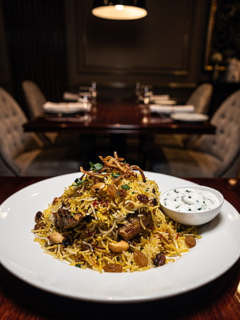Chicken Biryani with Raita in Upscale Restaurant