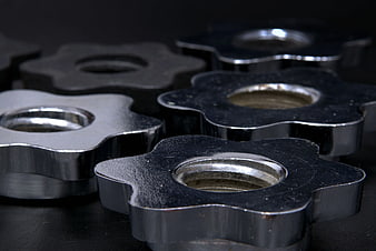 Close-up of gray steel floral-shaped industrial components
