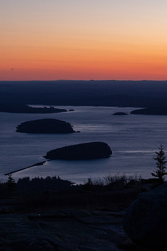 Serene Sunset Over Coastal Islands and Ocean
