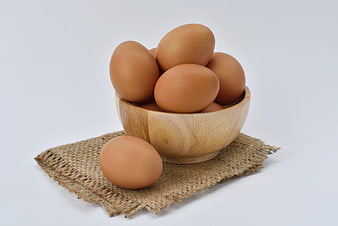Brown Eggs in Wooden Bowl on Burlap