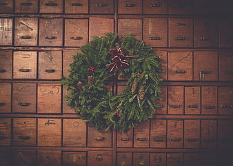 Vintage Christmas Wreath on Wooden Drawer Wall