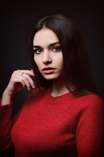 Studio Portrait of Young Woman in Red Sweater