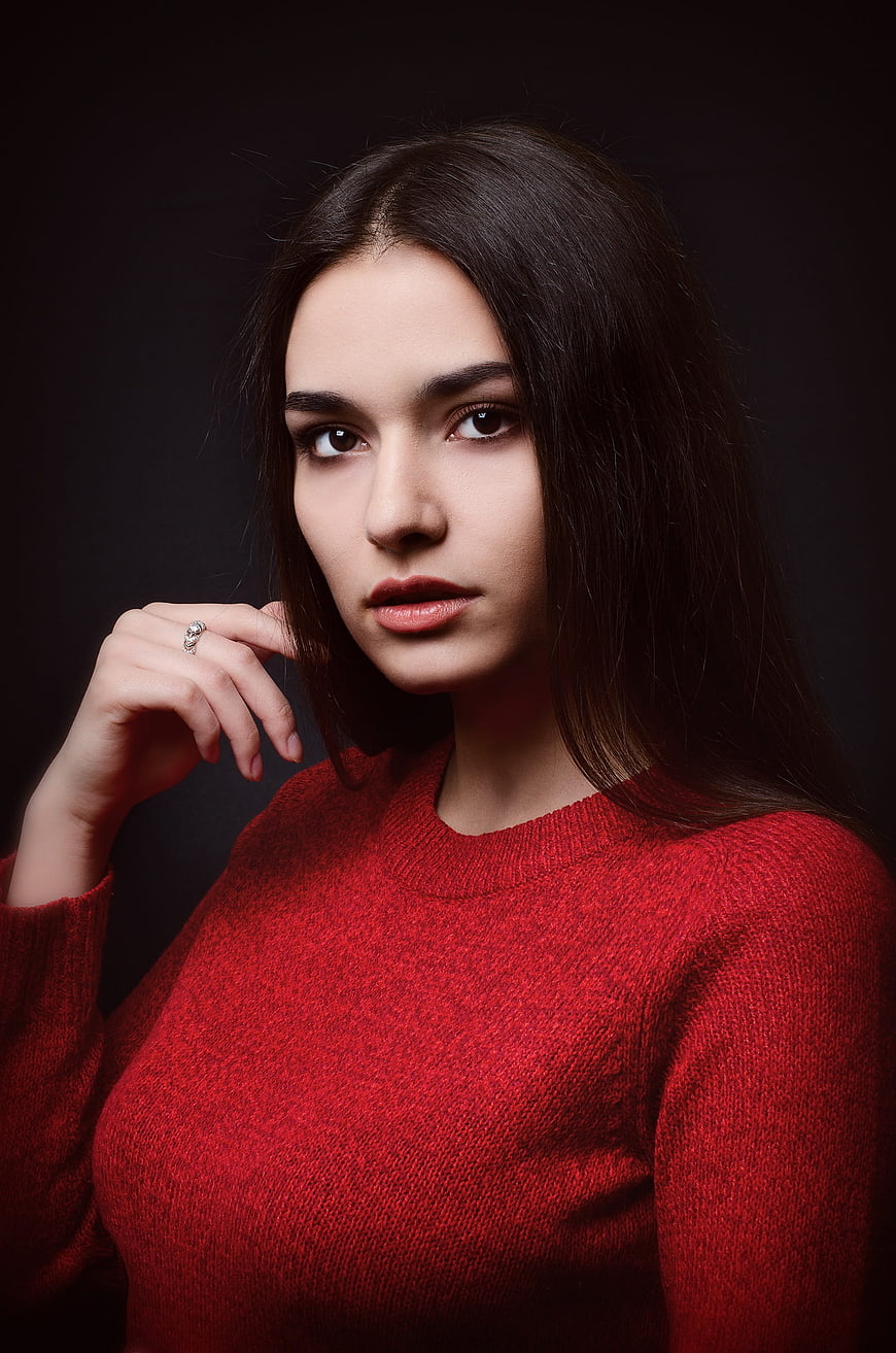 Studio Portrait of Young Woman in Red Sweater