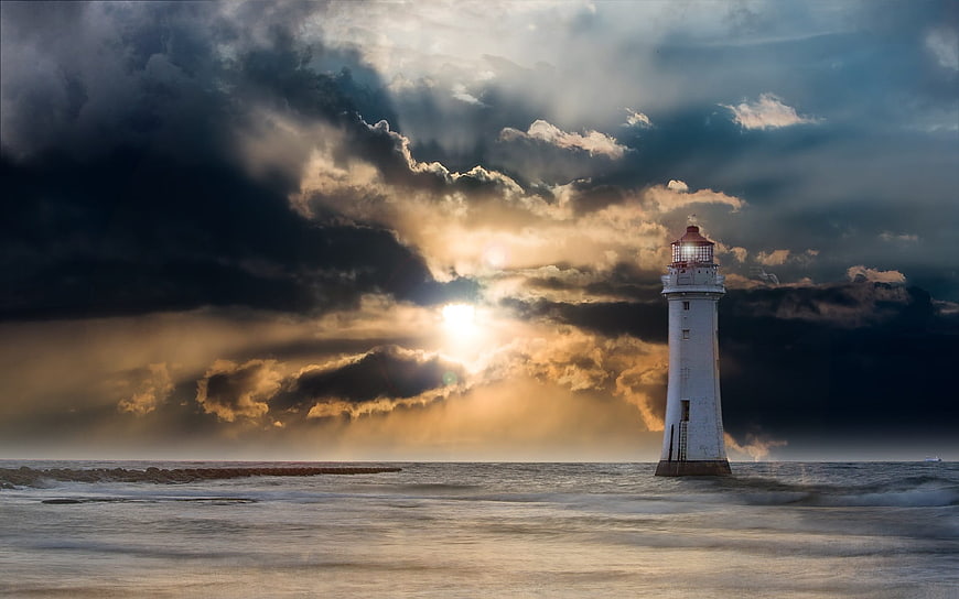 Dramatic Lighthouse in Stormy Sea with Sun Rays