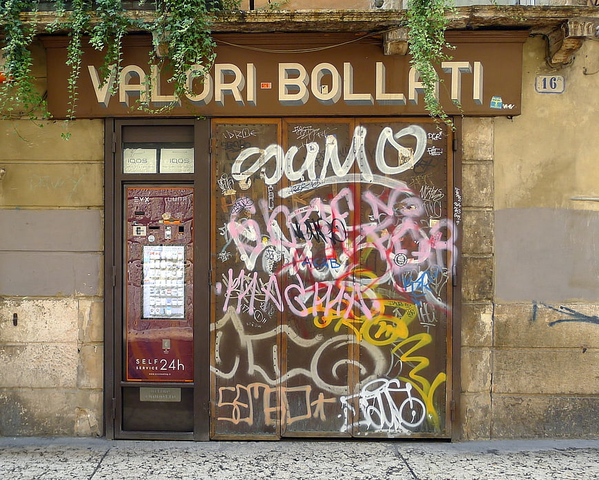 Graffiti-covered storefront in Verona, Italy