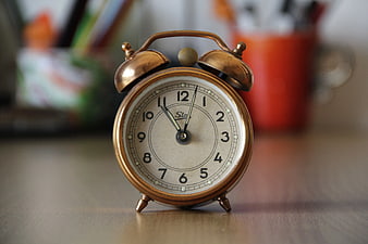 Vintage Brass Double Bell Alarm Clock on Wooden Desk