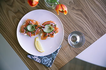 Smoked Salmon Bruschetta on White Plate with Lemon