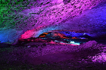 Colorful Cave Interior with Neon Lighting