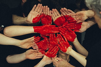 Group of Hands with Red Paint in Circle