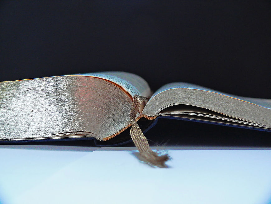 Close-up of Open Book with Ribbon Bookmark