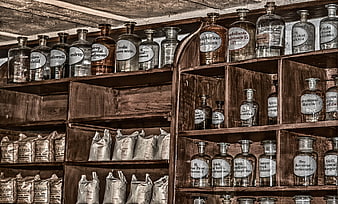 Antique Apothecary Shelves with Vintage Glass Medicine Bottles