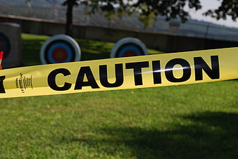 Yellow Caution Tape at Outdoor Archery Range