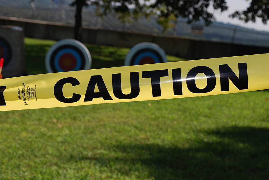 Yellow Caution Tape at Outdoor Archery Range