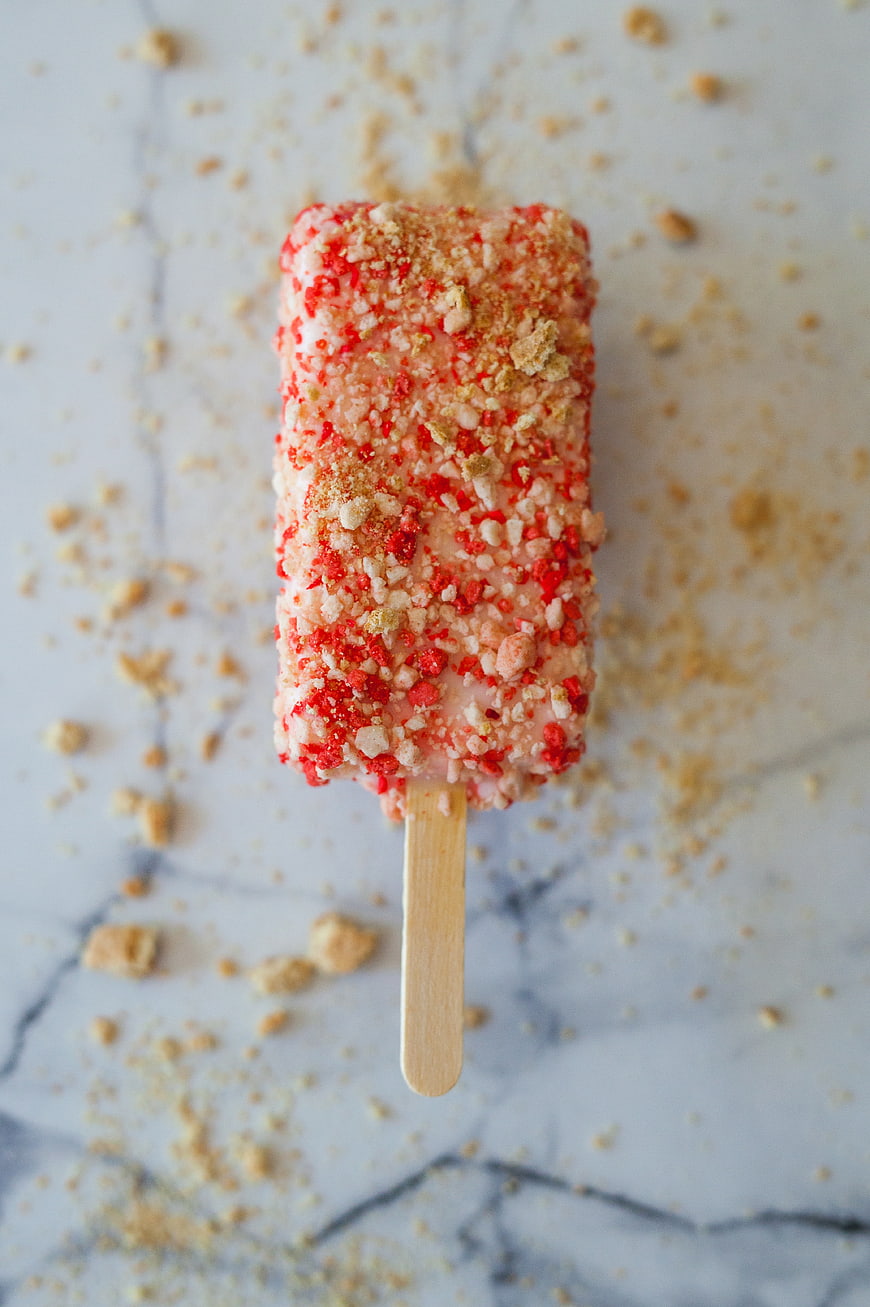 Top View Strawberry Ice Cream Bar with Crushed Cookie Crumbs