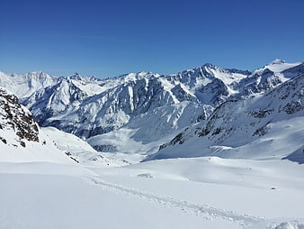 Snowy Mountain Range Landscape with Blue Sky