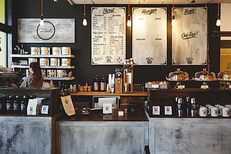 Modern Industrial Coffee Shop Interior with Menu Boards