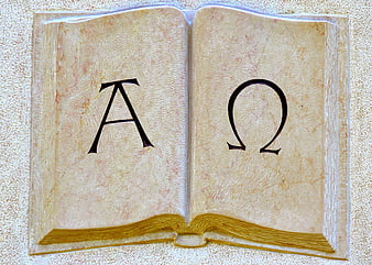 Stone Carving of Alpha and Omega Symbols on Open Book