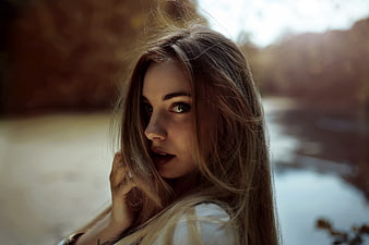 Portrait of a beautiful woman with long hair outdoors
