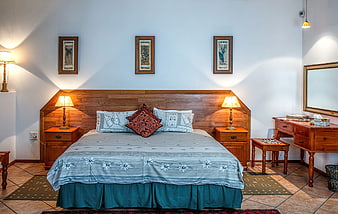 Cozy Bedroom Interior with Wooden Furniture and Blue Bedding