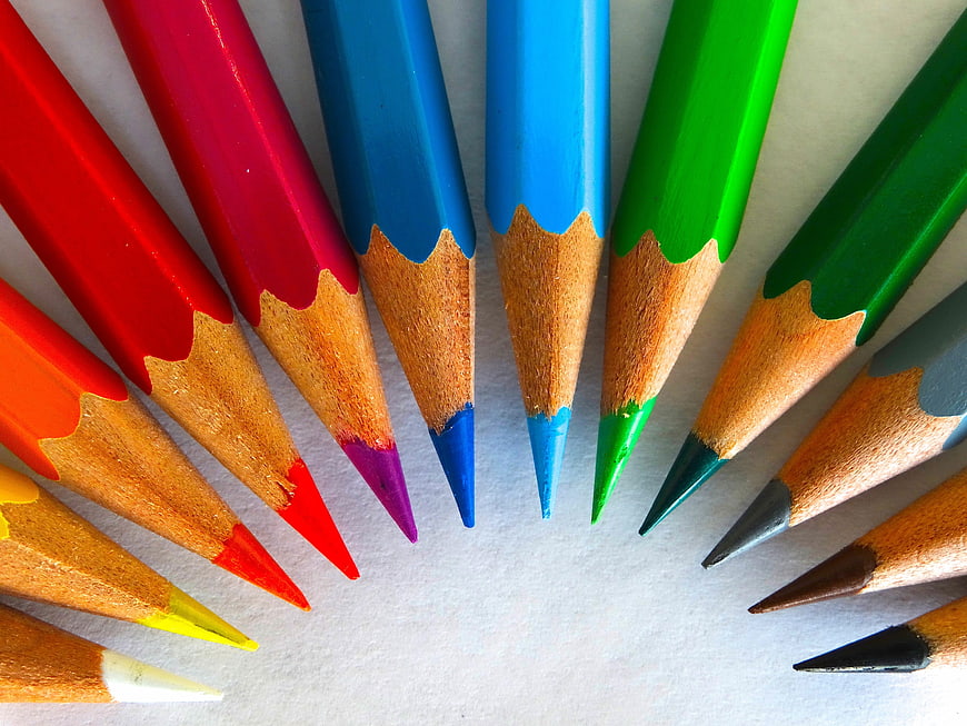 Close-up of colorful sharpened pencils arranged in a semi-circle