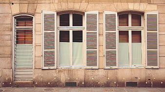 Vintage European Building Facade with Shutters