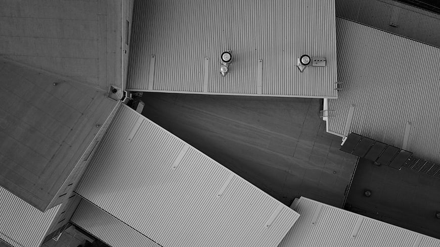 Aerial Black and White View of Industrial Metal Rooftops