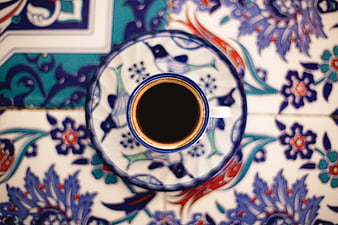 Overhead View of Coffee Cup on Decorative Ceramic Tile