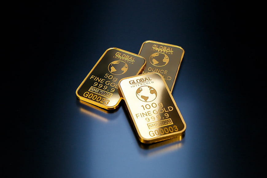 Gold bars on dark blue background for finance
