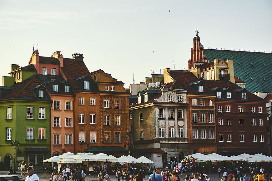 Colorful historic buildings in a bustling European city square