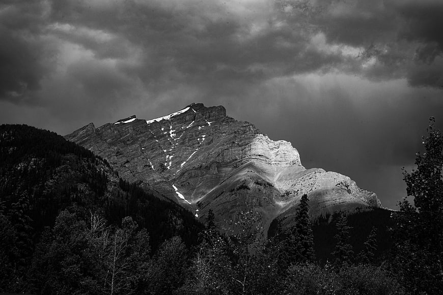 Dramatic Black and White Mountain Peak with Sunlight
