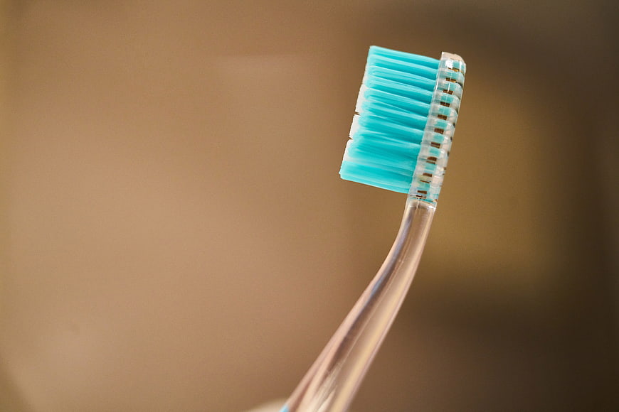 Close-up of Blue Toothbrush Head on Blurred Background