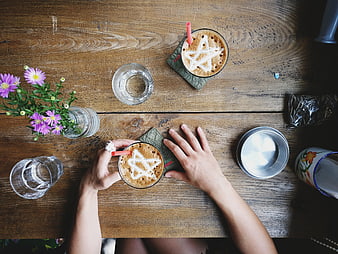 Top view of Vietnamese egg coffee with star latte art on wooden table