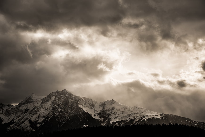 Dramatic Sepia Mountain Landscape with Stormy Clouds