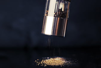 Freshly Ground Black Pepper Falling from Shaker