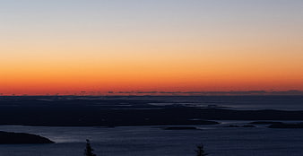 Serene Sunset Over Coastal Islands and Ocean