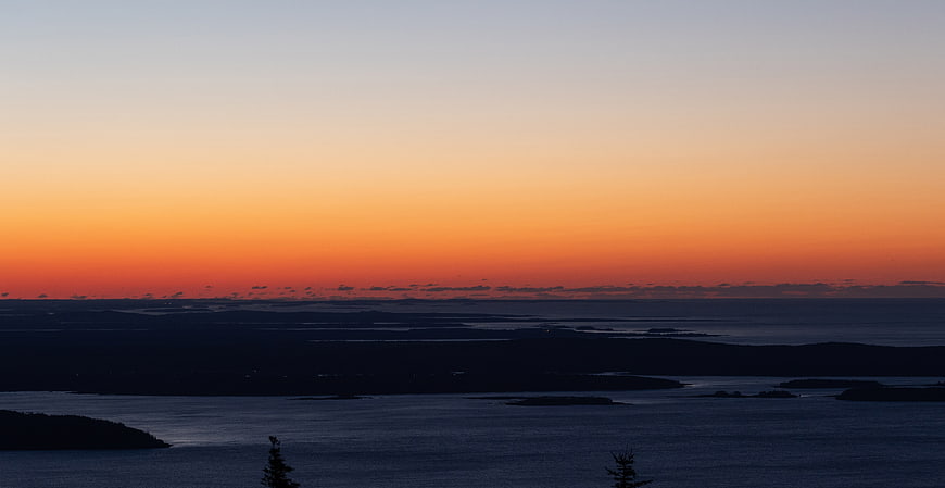 Serene Sunset Over Coastal Islands and Ocean