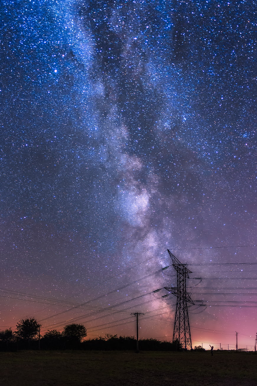 Milky Way Galaxy Over Silhouette of Power Lines at Night