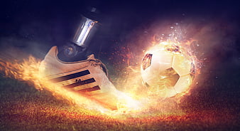 Robotic prosthetic leg kicking flaming soccer ball on grass