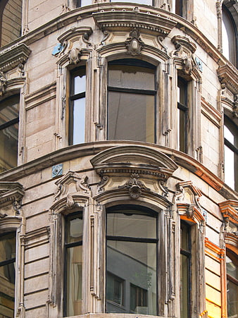Ornate Beige Stone Building Facade with Arched Windows