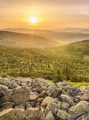 Sunrise Over Bavarian Forest Mountains With Rocky Foreground