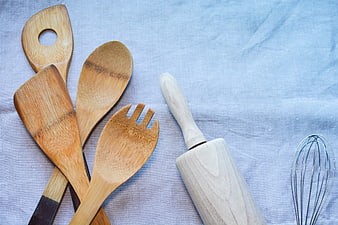 Wooden Kitchen Utensils and Rolling Pin on Blue Linen