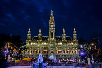 Vienna City Hall Illuminated At Night With Christmas Market And Ice Rink