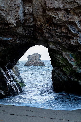 Ocean View Through Rocky Archway with Sea Stack