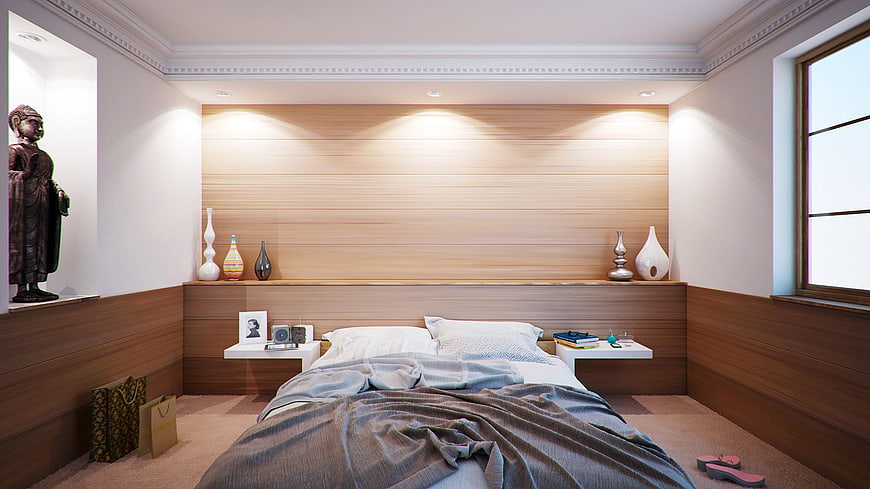 Modern Bedroom Interior with Wooden Wall and Buddha Statue