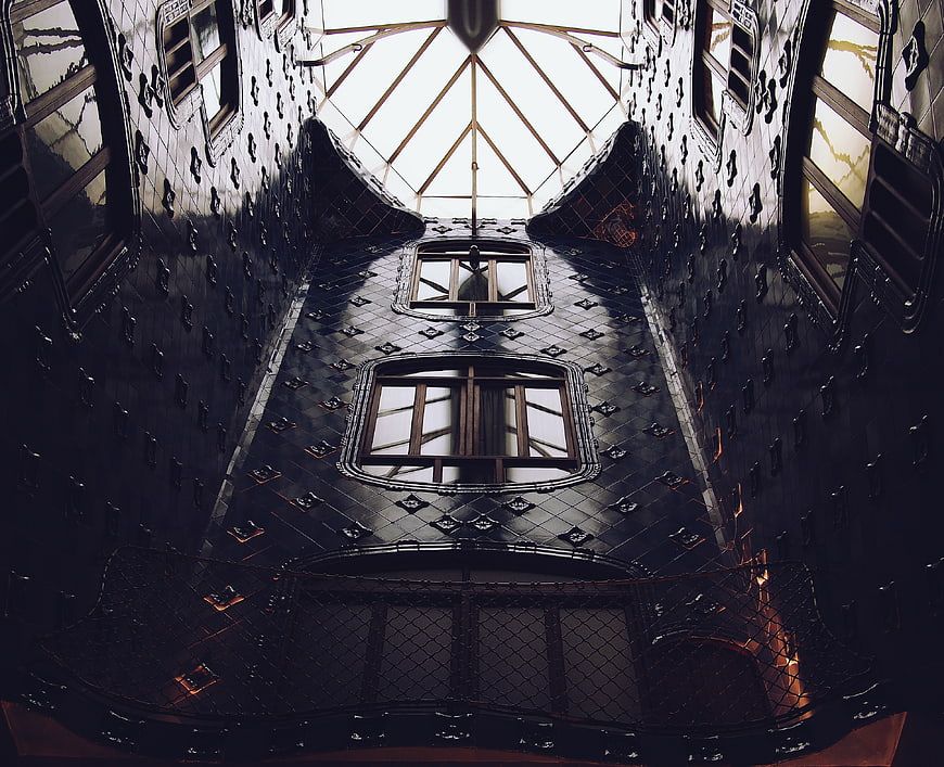Low angle view of ornate dark tiled interior with skylight